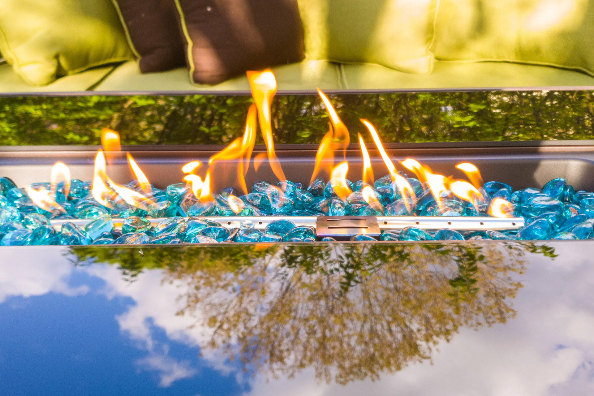 a cozy gas fire pit area with comfortable seating, reflecting the tranquility of the surrounding trees, perfect for evening relaxation