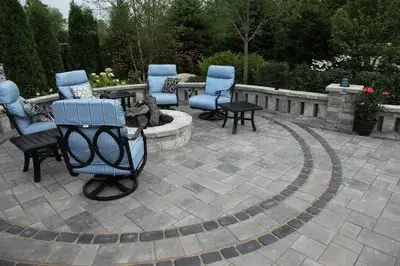 a beautifully arranged outdoor living area with comfortable seating, lush greenery, and elegant landscaping, perfect for relaxation and entertainment.